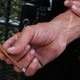 A man holds a K2 cigarette.